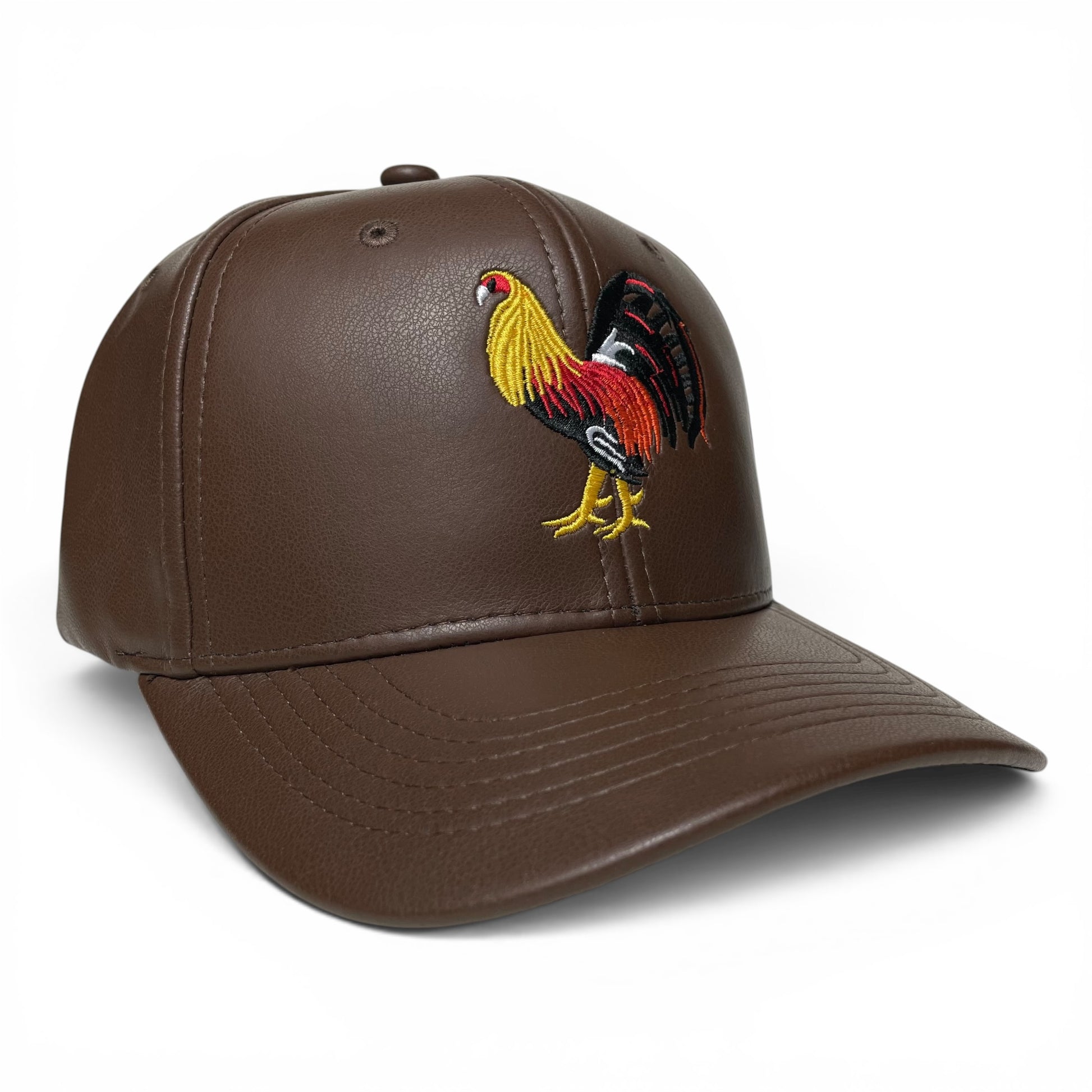 ROABEN brown PU leather snapback cap with rooster design, 6-panel construction, mid-profile crown, and slight curved visor.