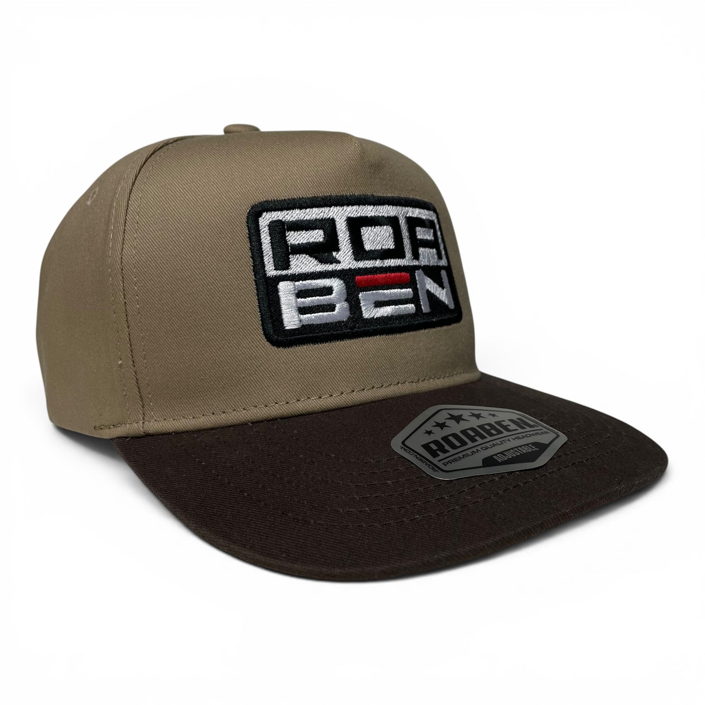 ROABEN khaki and brown snapback baseball cap featuring embroidered branding, structured crown, curved brim, and adjustable snapback closure.